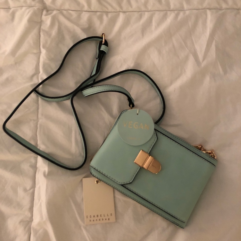 Turquoise purse with built in card holder inside.